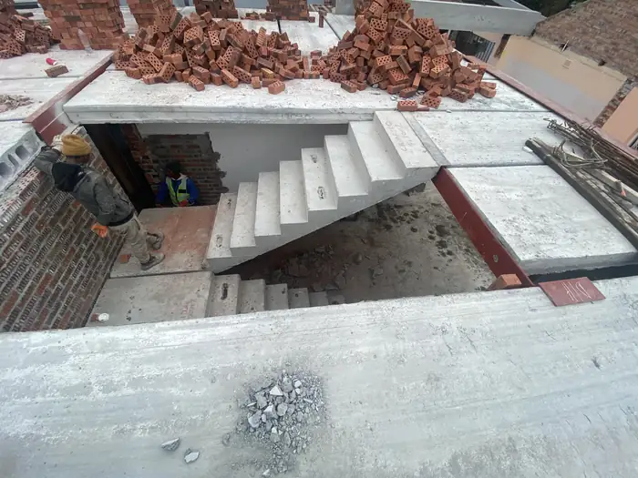 The new first floor slab at House Braeview with the stair void opened and the precast stair landed in it