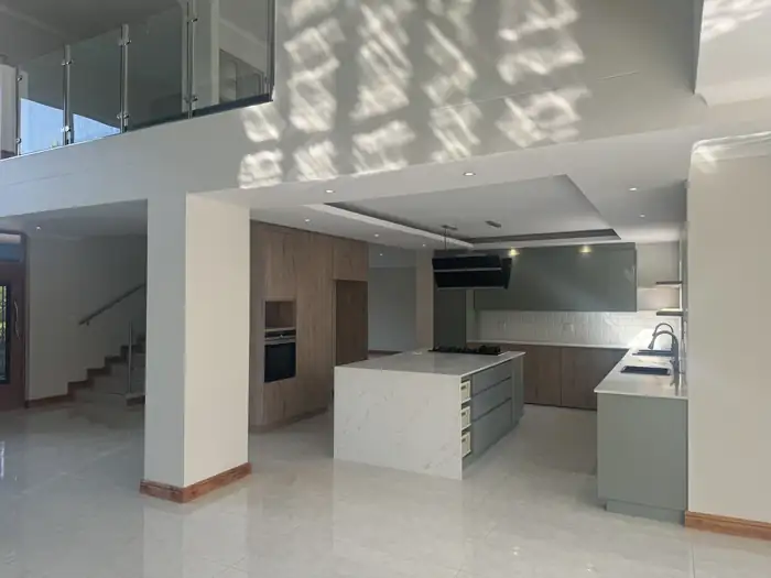 The upper level looking down over the open plan kitchen and living space