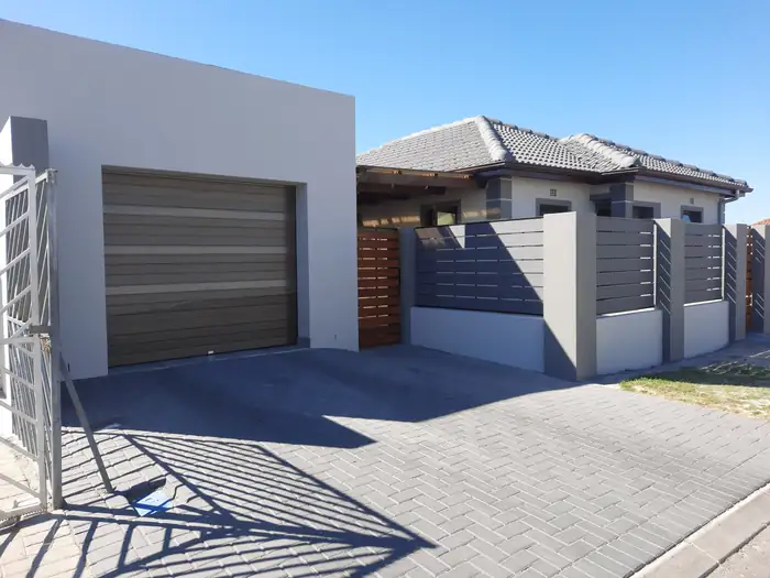 The garage door and vehicle gate matched to one another