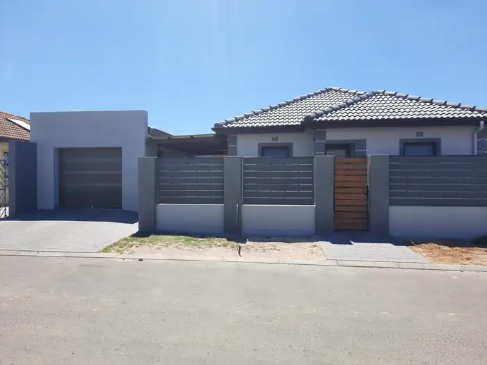 The street elevation with the boundary screen running past the garage
