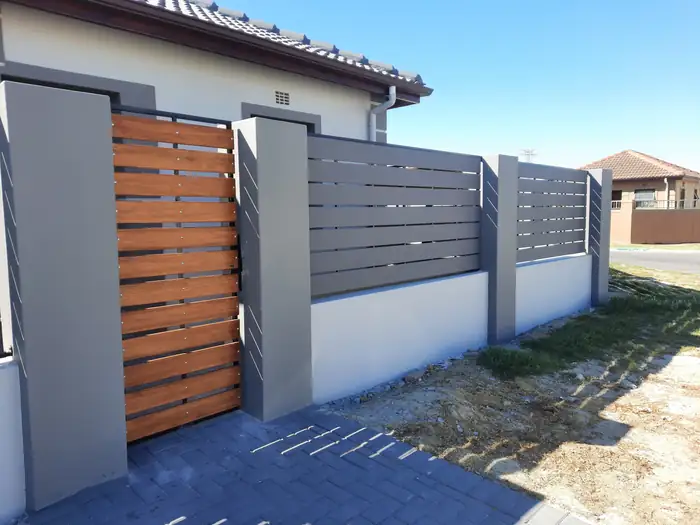 The timber infill gate set into the slatted screen