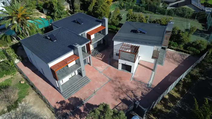 The whole property from above, all three houses and the shared paving between them