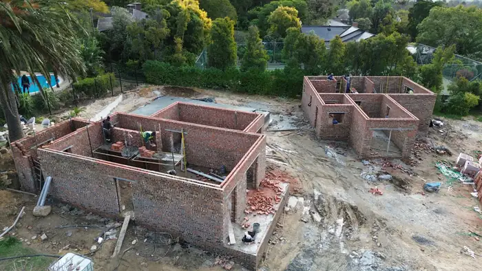 Ground floor walls formed on all three houses at once