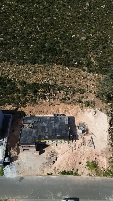 Rock excavated off the slope alongside the new slab
