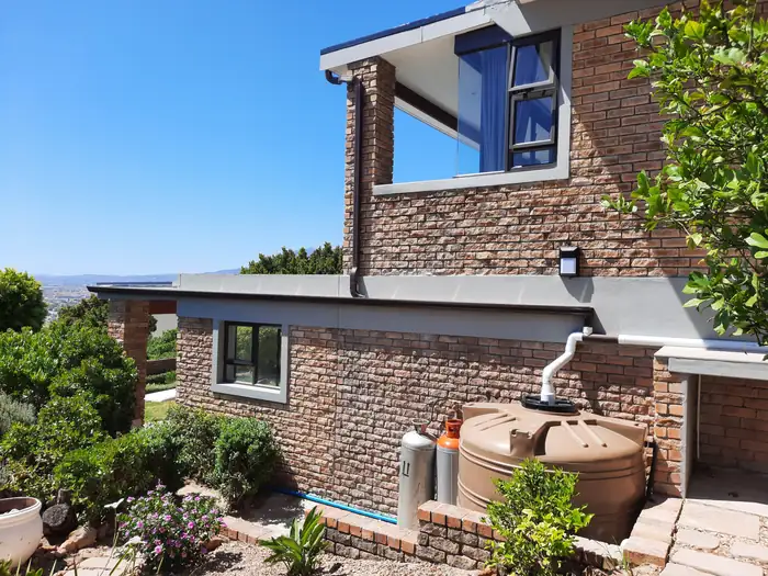 The lower side of the property with the rainwater tanks plumbed in