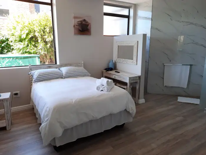 A guest suite with the vanity open to the bedroom